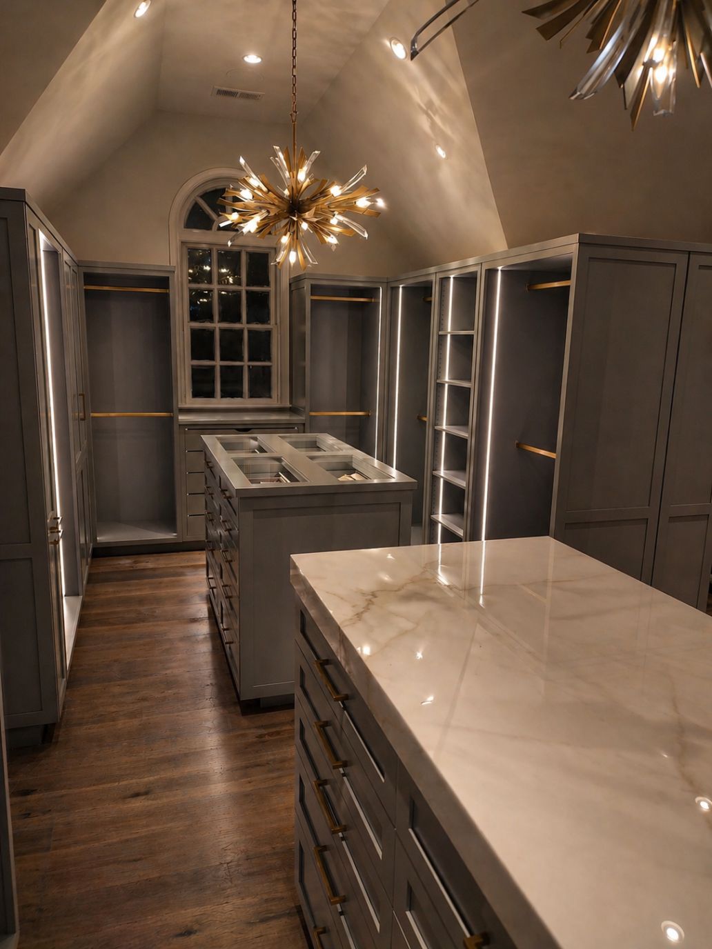 custom-built cabinets in a blue-gray painted finish, illuminated built-in shelving