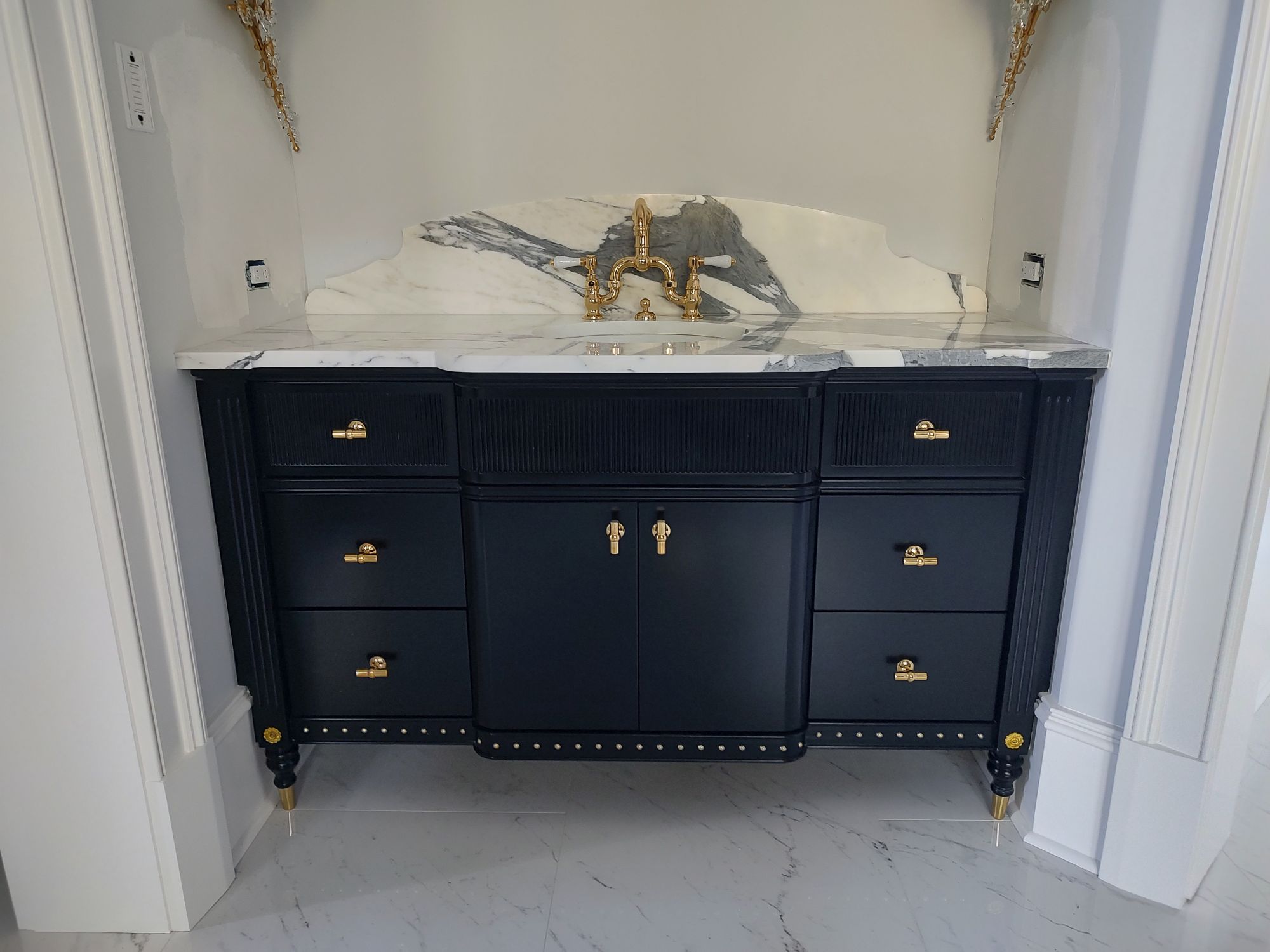 bathroom vanity with a painted black finish