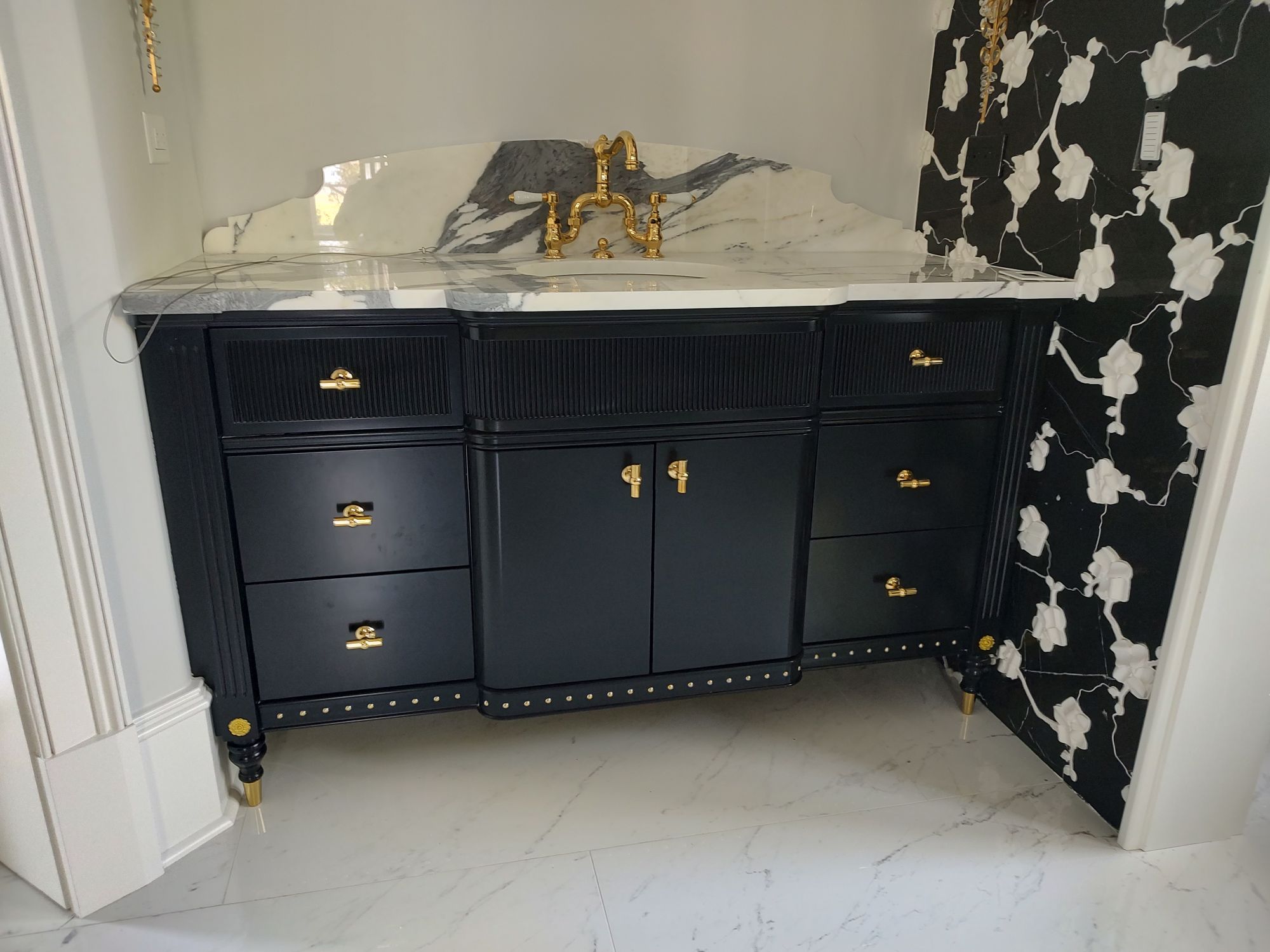 bathroom vanity with a painted black finish
