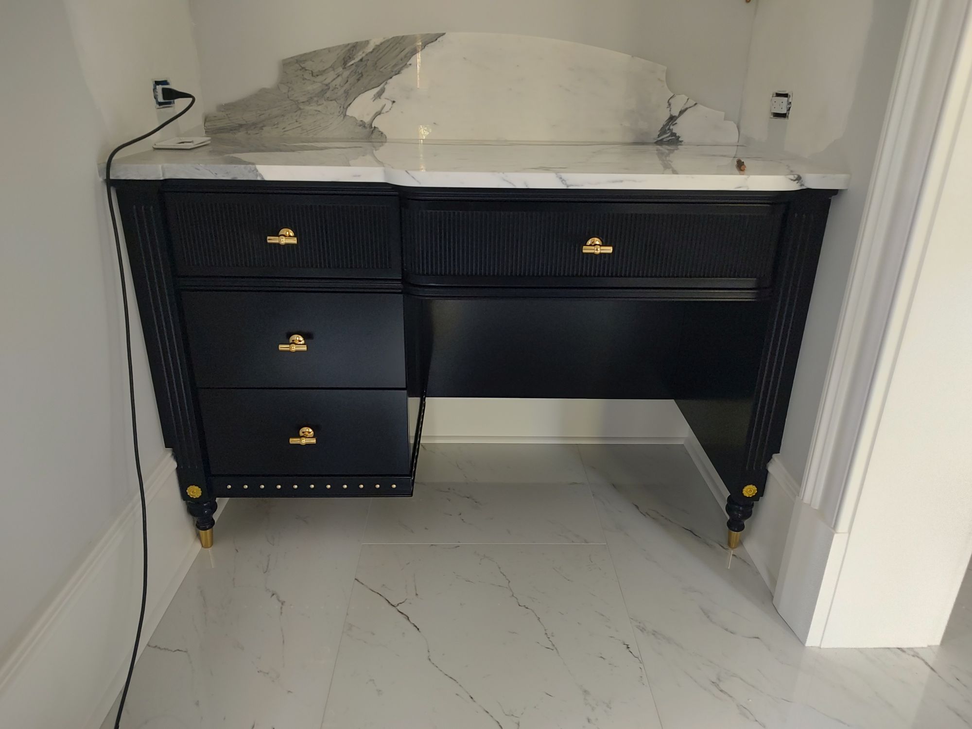 bathroom vanity with a painted black finish