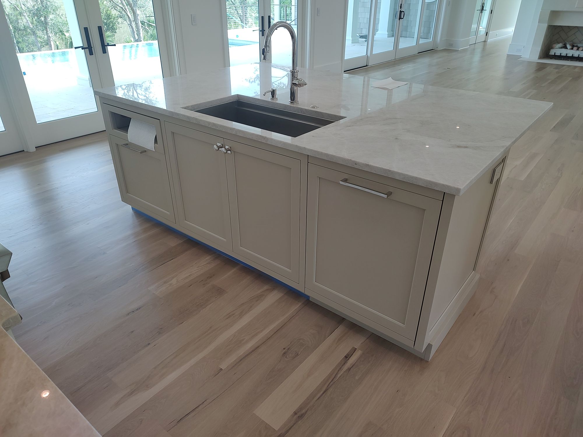 Custom build white cabinets  and sandstone counter